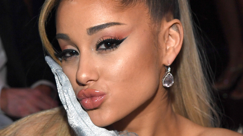 Ariana Grande blowing a kiss