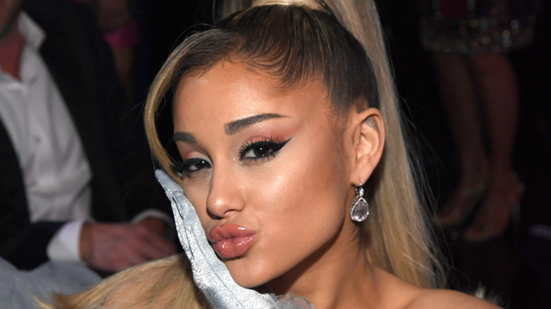 Ariana Grande blowing a kiss