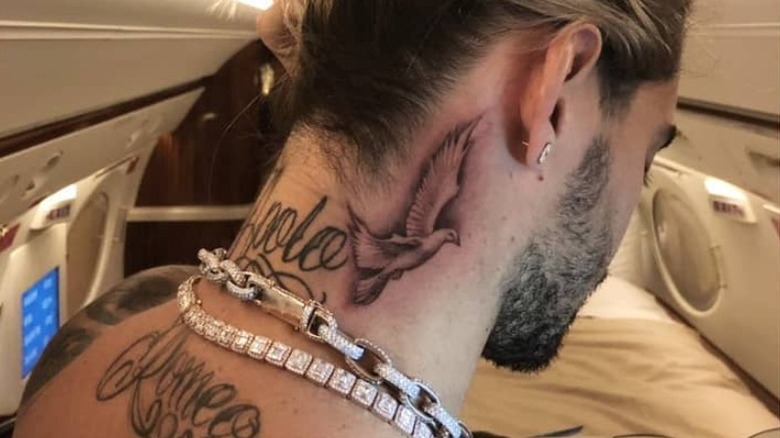 Singer Maluma displaying his neck tattoos