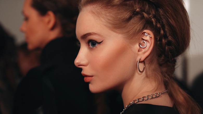 Woman with pierced ear 