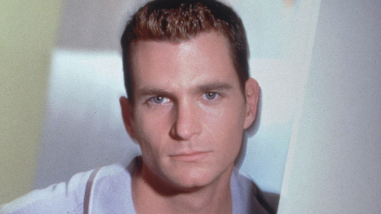 David Strickland posing for a portrait wearing blue polo shirt