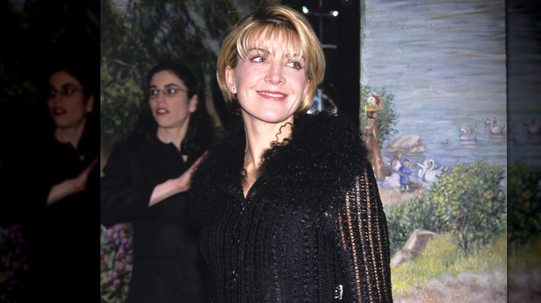 Natasha Richardson smiling in a black dress at a New York event