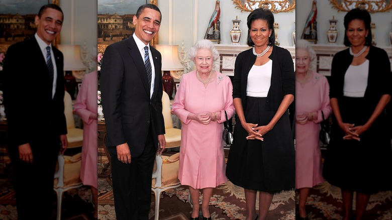 Michelle and Barack Obama smiling next to Queen Elizabeth II