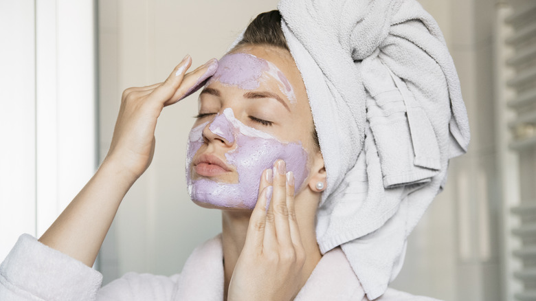 Woman using facial mask