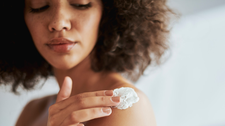 Woman applying cream