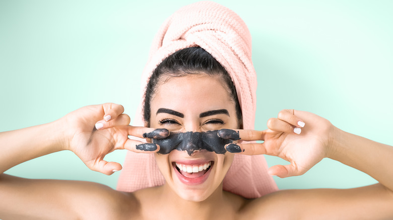 Woman using exfoliating scrub