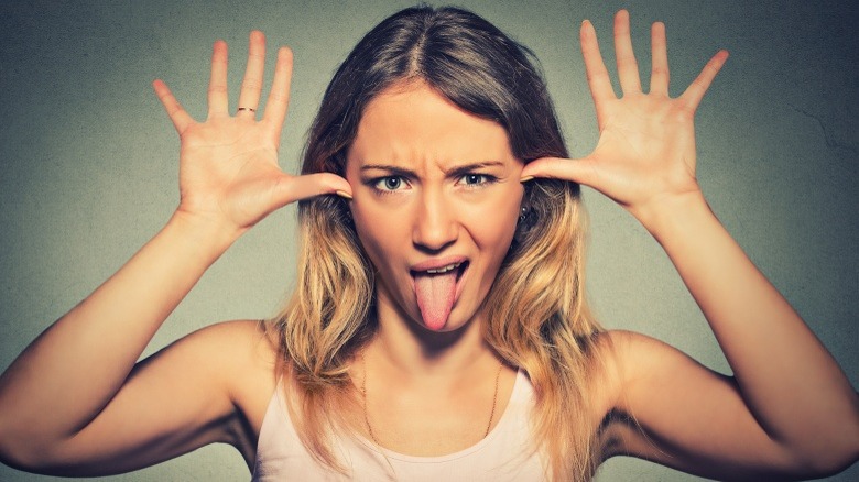 woman making face being rude