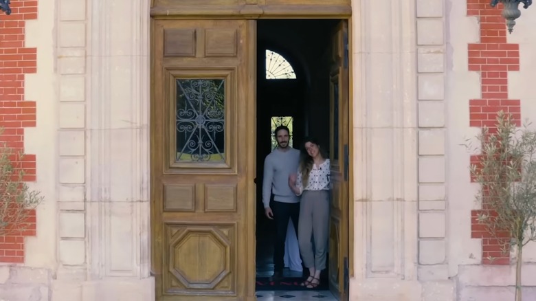 Daphne Reckert and her husband in the entryway of their chateau