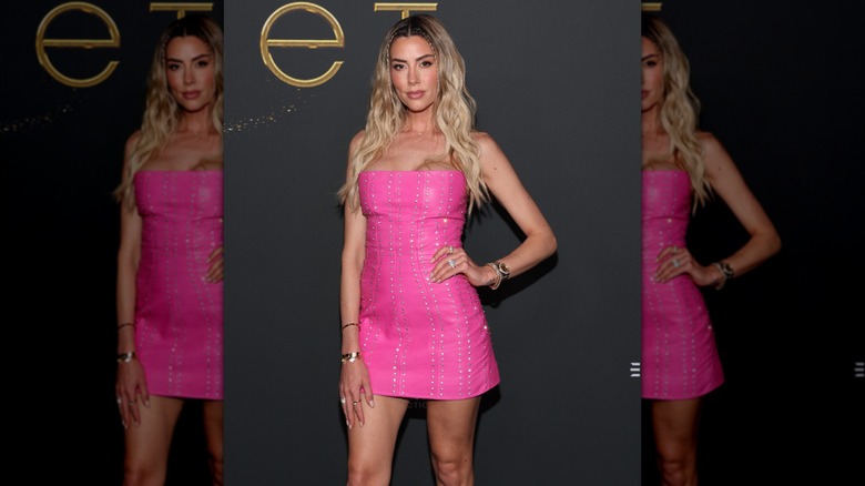 Heather Rae El Moussa in a pink strapless dress at an event