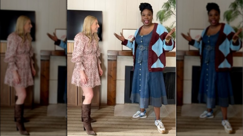Leslie Jones in a denim dress with a bright sweater and sneakers next to a blonde woman