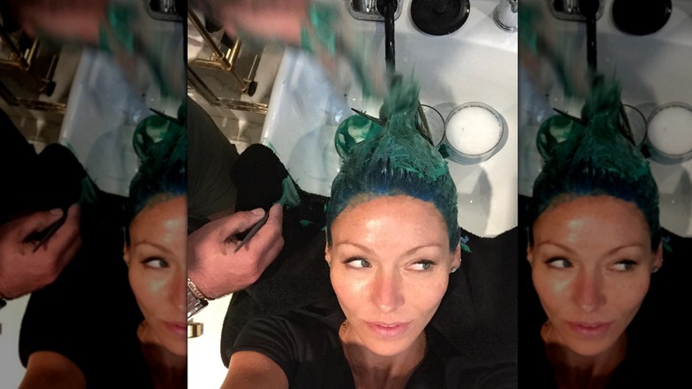 Kelly Ripa with hair dye in her hair