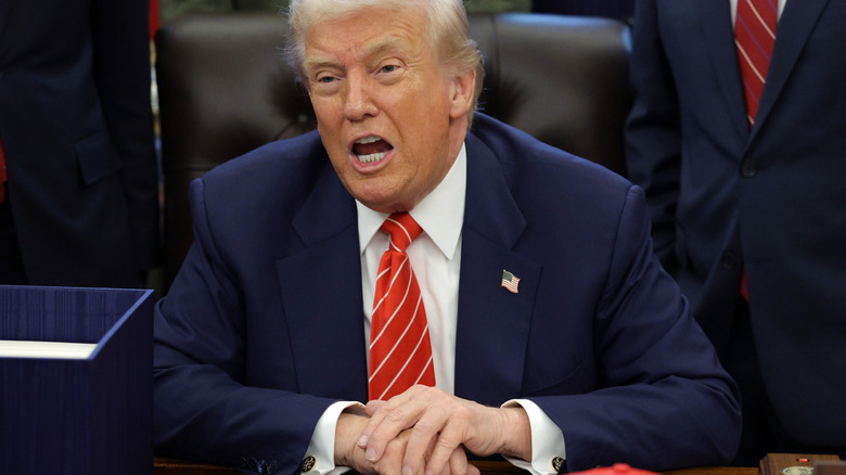 Donald Trump speaks from the Oval Office during a bill signing