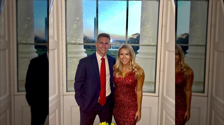 Karoline Leavitt poses at the White House during Christmas time