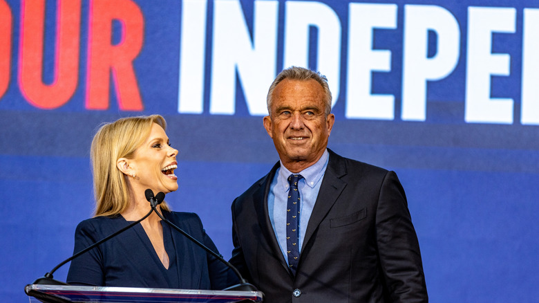 Robert F. Kennedy, Jr. and Cheryl Hines speak at a rally in Oakland, California