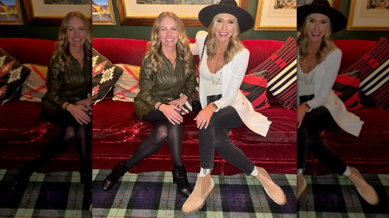 Lara Trump wears a black hat and smiles while seated next to another woman