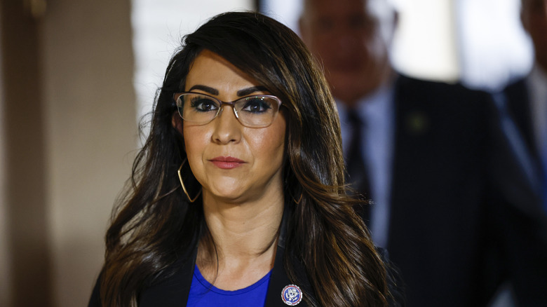 Lauren Boebert gazes at the camera in brown glasses