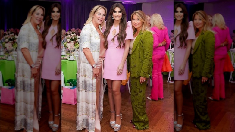 Kimberly Guilfoyle smiles for a photo in a pink dress