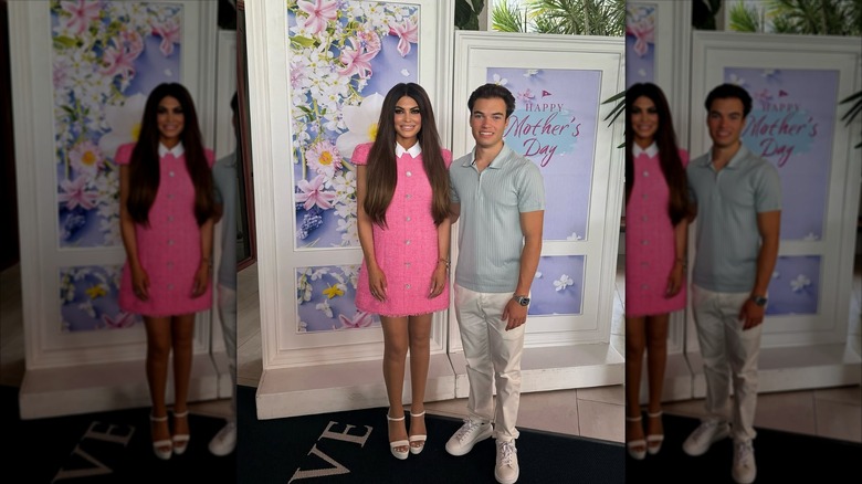 Kimberly Guilfoyle poses with son in front of decorated backdrop for Mother's Day