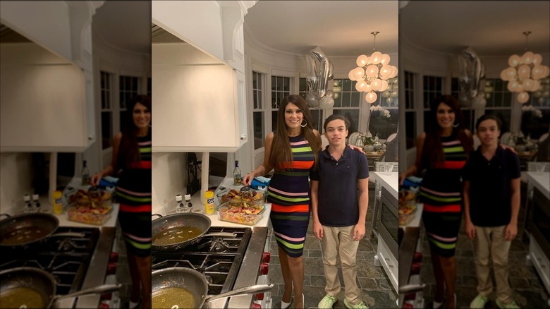 Kimberly Guilfoyle smiles for photo with son in the kitchen