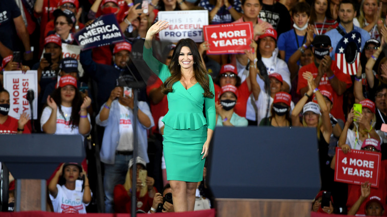 Kimberly Guilfoyle waving at political event supporting Donald Trump