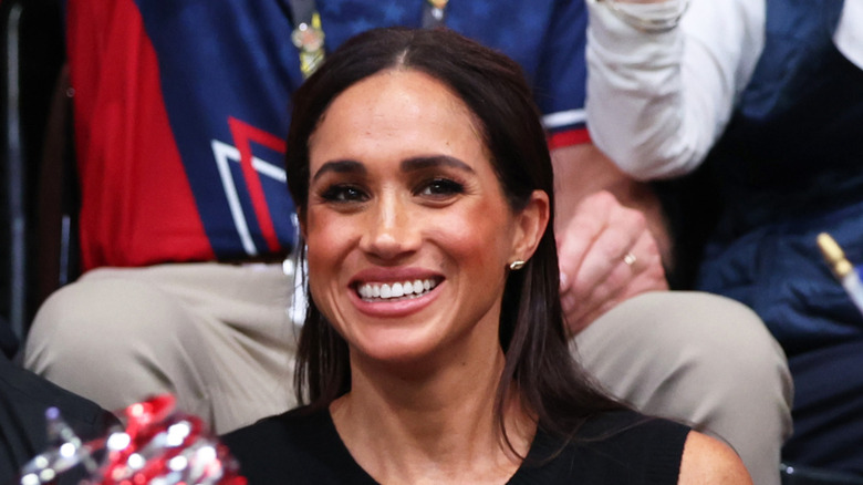 Close-up of Meghan Markle smiling in audience
