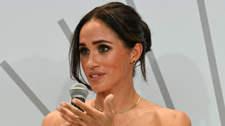 Meghan Markle speaking into mic