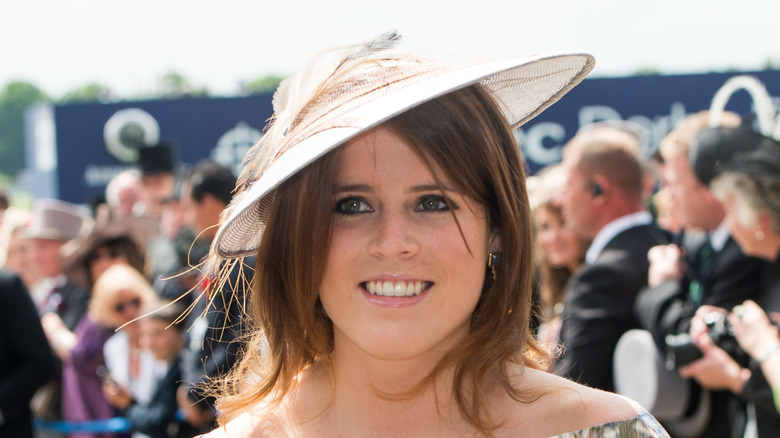 Princess Eugenie smiling in wide-brimmed hat