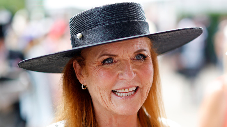 Close-up of Sarah Ferguson smiling in a wide-brimmed hat