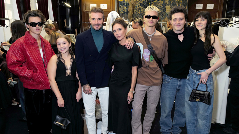 David and Victoria Beckham pose with their four children plus Nicola Peltz