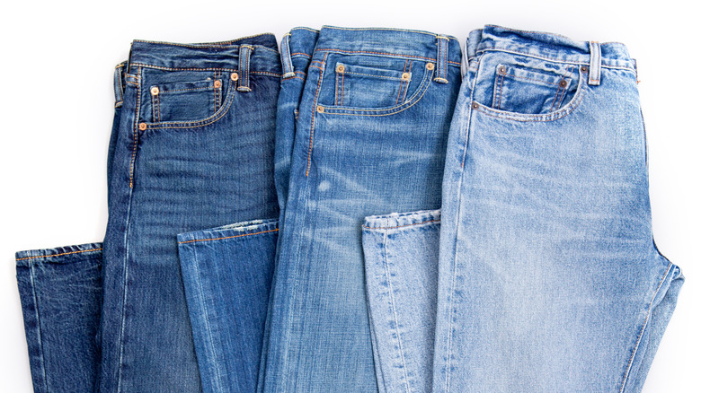 Denim jeans in different shades of blue
