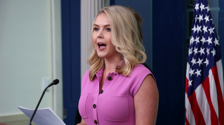 Karoline Leavitt gives a speech while wearing pink