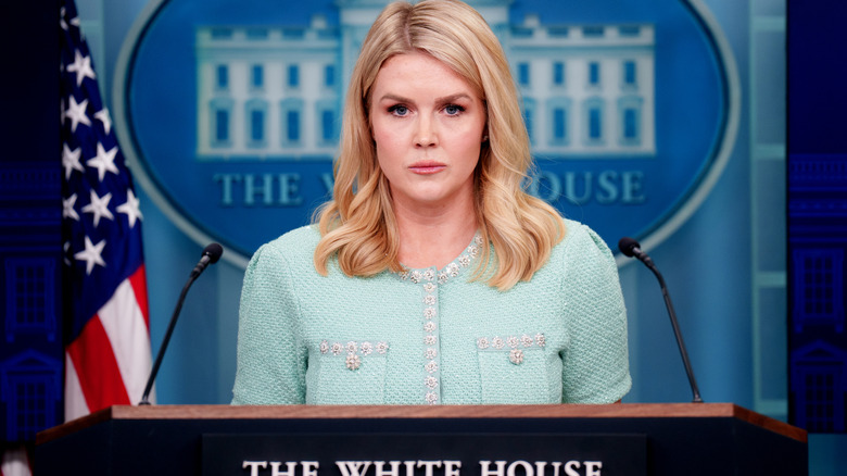 Karoline Leavitt looking livid during a press briefing in a mint jacket
