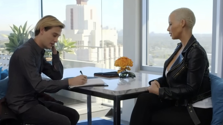 Hollywood Medium's Tyler Henry sits during a reading with Amber Rose