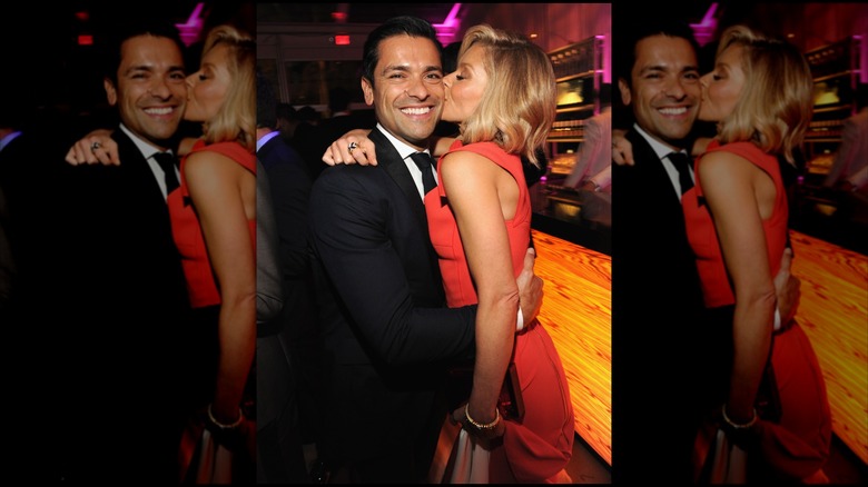 Kelly Ripa and Mark Consuelos posing in 2014
