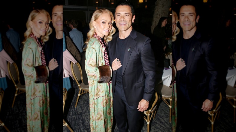 Kelly Ripa and Mark Consuelos posing in 2026