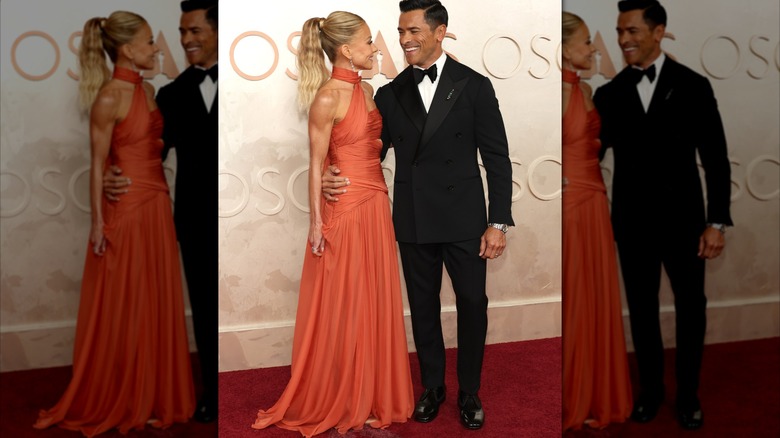Kelly Ripa and Mark Consuelos posing in 2025