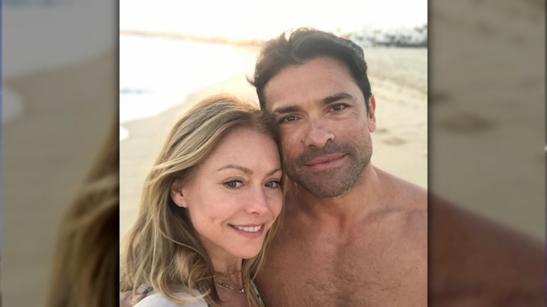 Kelly Ripa and Mark Consuelos taking a beach selfie