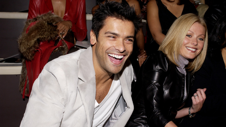 Kelly Ripa and Mark Consuelos smiling in 2002