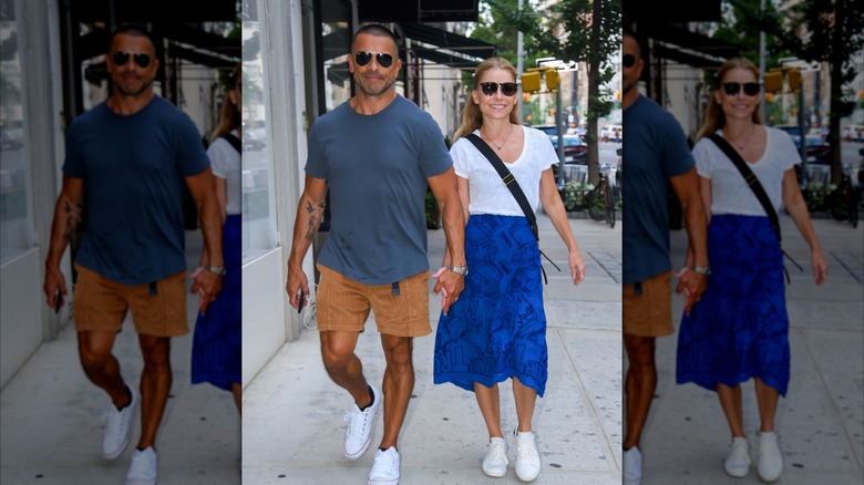 Kelly Ripa and Mark Consuelos walking down the street in 2022