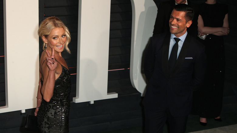 Kelly Ripa and Mark Consuelos posing in 2016