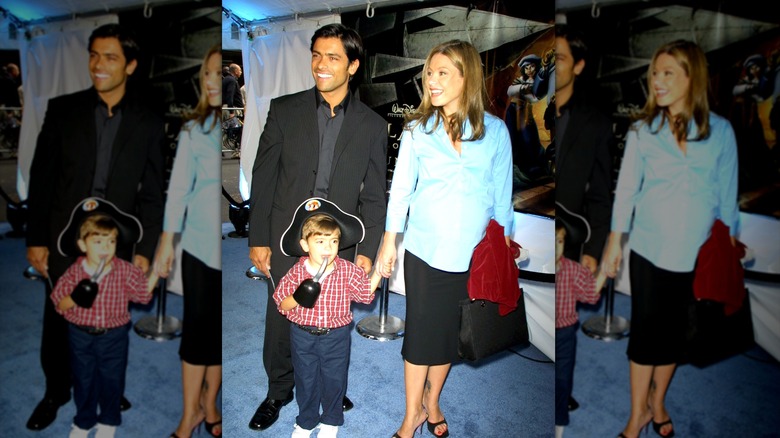 Kelly Ripa, Mark Consuelos, and their child in 2001