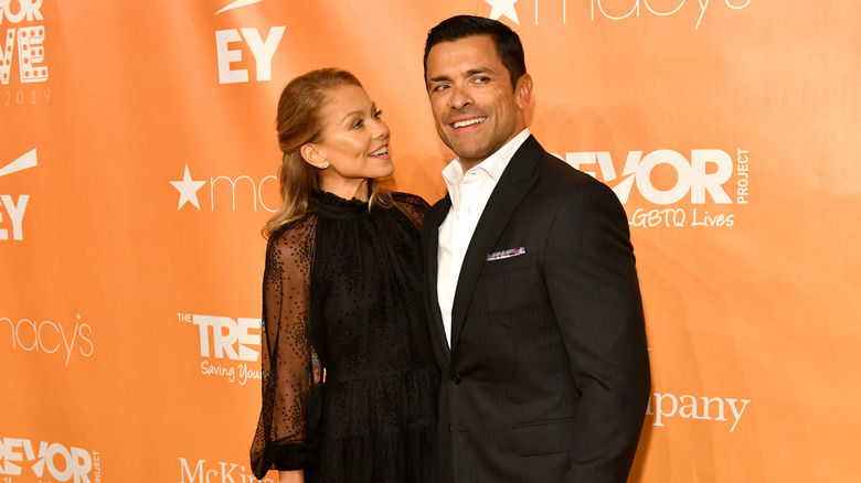 Kelly Ripa and Mark Consuelos posing in 2019