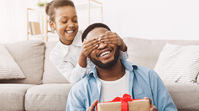 Girl with present for father