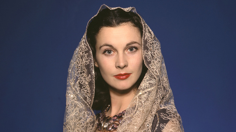 Vivien Leigh poses in lace shawl in color studio publicity portrait, circa 1942