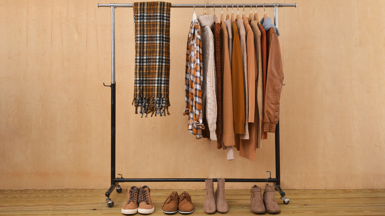 clothes hanging on a clothing rack 