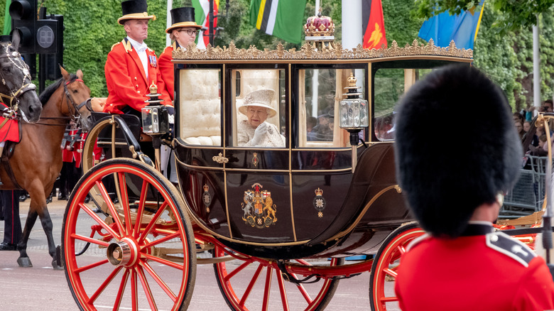 Queen Elizabeth waving from the royal coach