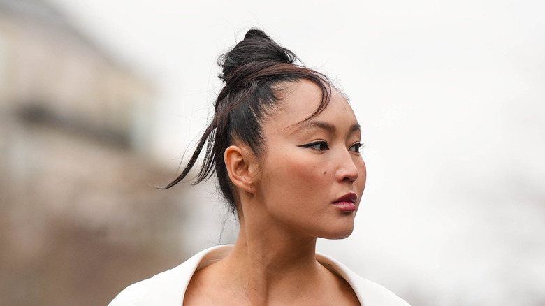 woman hair in bun at Paris Fashion Week