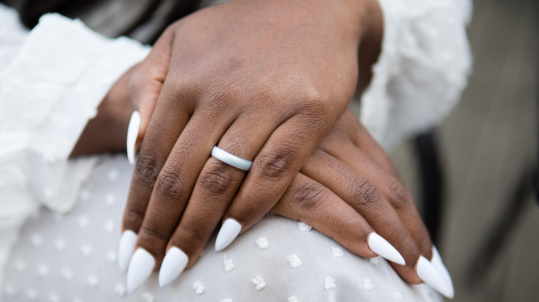 bride showing off simple manicure