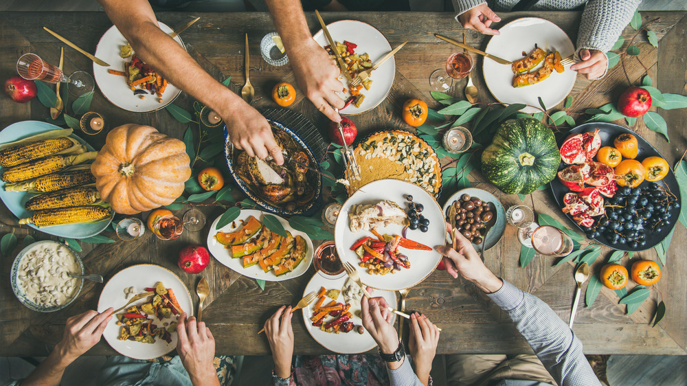 An overhead view of people enjoying a Thanksgiving meal 