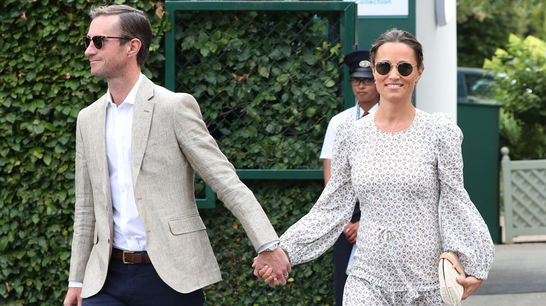 Pippa Middleton and James Matthews walking hand in hand